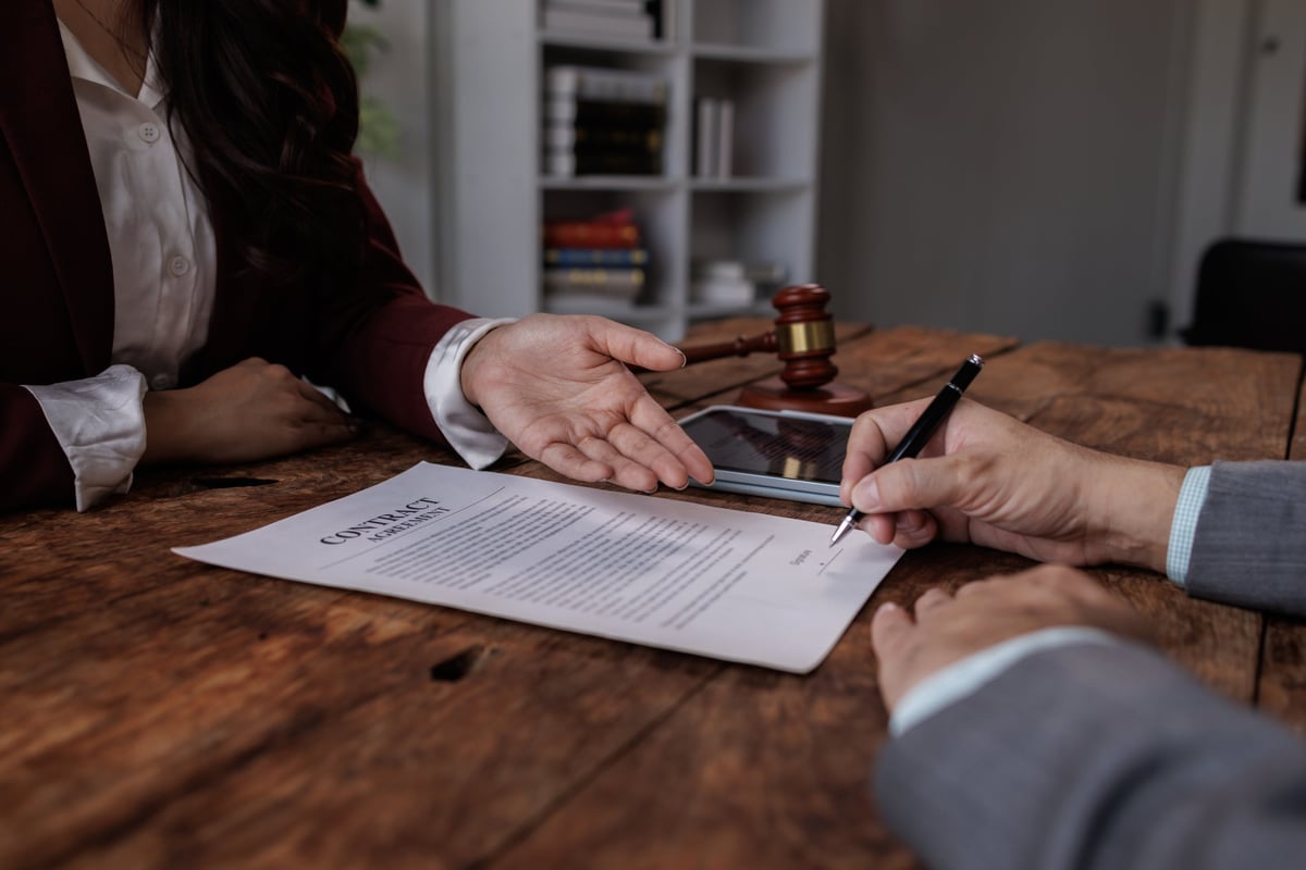 Notary with client in office.